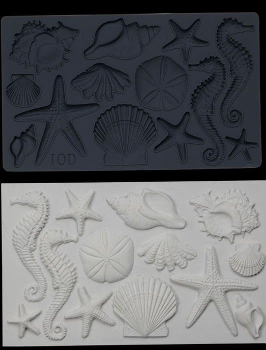 Iron Orchid Designs Seashells grey Mould above white clay castings of the mould