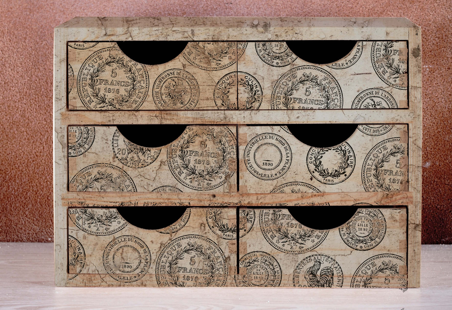 A set of six small drawers decorated with Iron Orchid Designs Antiquities stamps