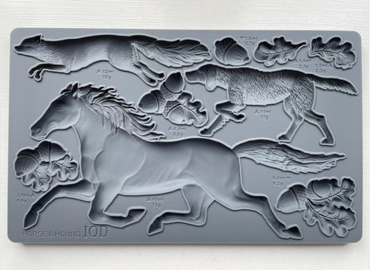 Iron Orchid designs Horse and Hound grey mould laying on a wooden surface